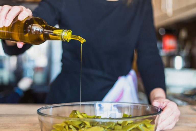 crop-hands-woman-cooking-salad-kitchen_23-2147810069